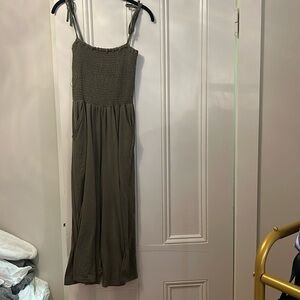 Green cropped jumpsuit with pockets